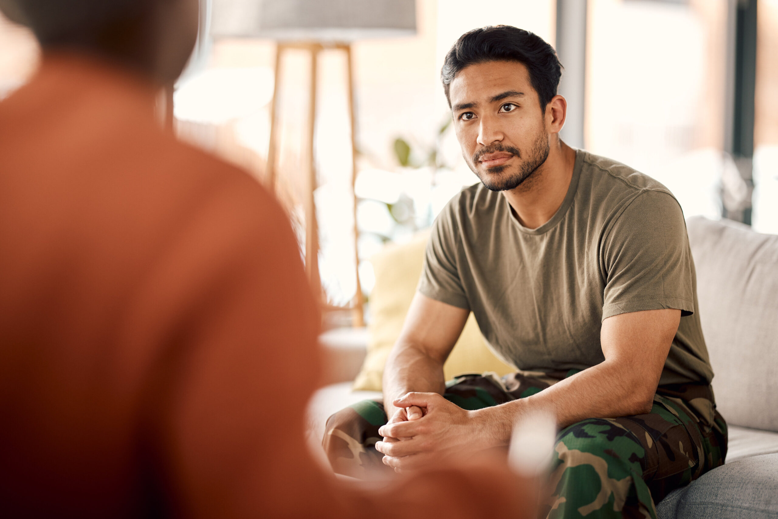 Man talking calmly in a therapy session for stress and hormone balance