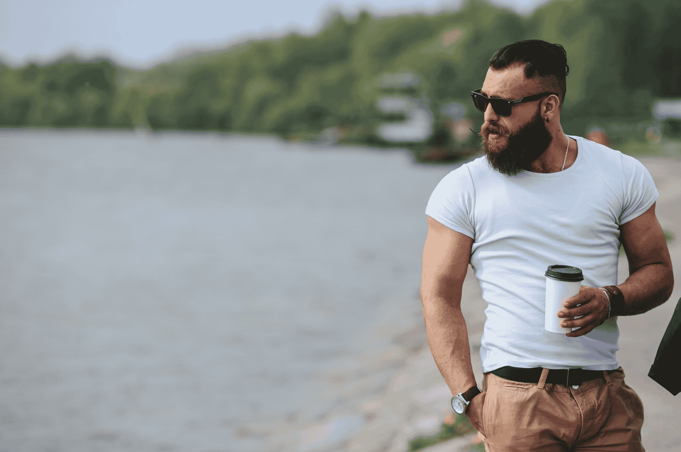 Thoughtful man standing, considering the benefits and uses of testosterone cypionate.